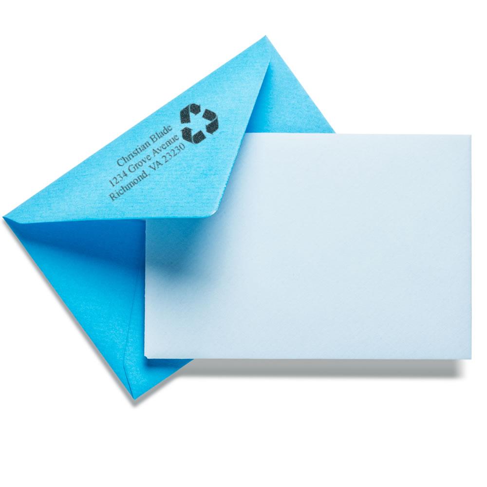 Custom return address rubber stamp on blue envelope with recycling icon, ideal for eco-friendly business and personal mail.