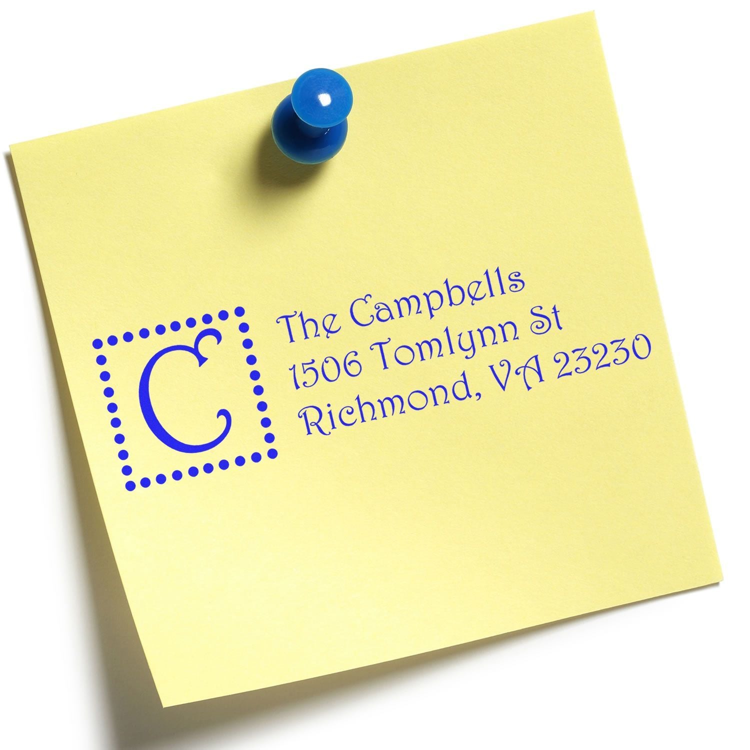 Personalized return address rubber stamp impression on yellow note with blue monogram and The Campbells Richmond address.