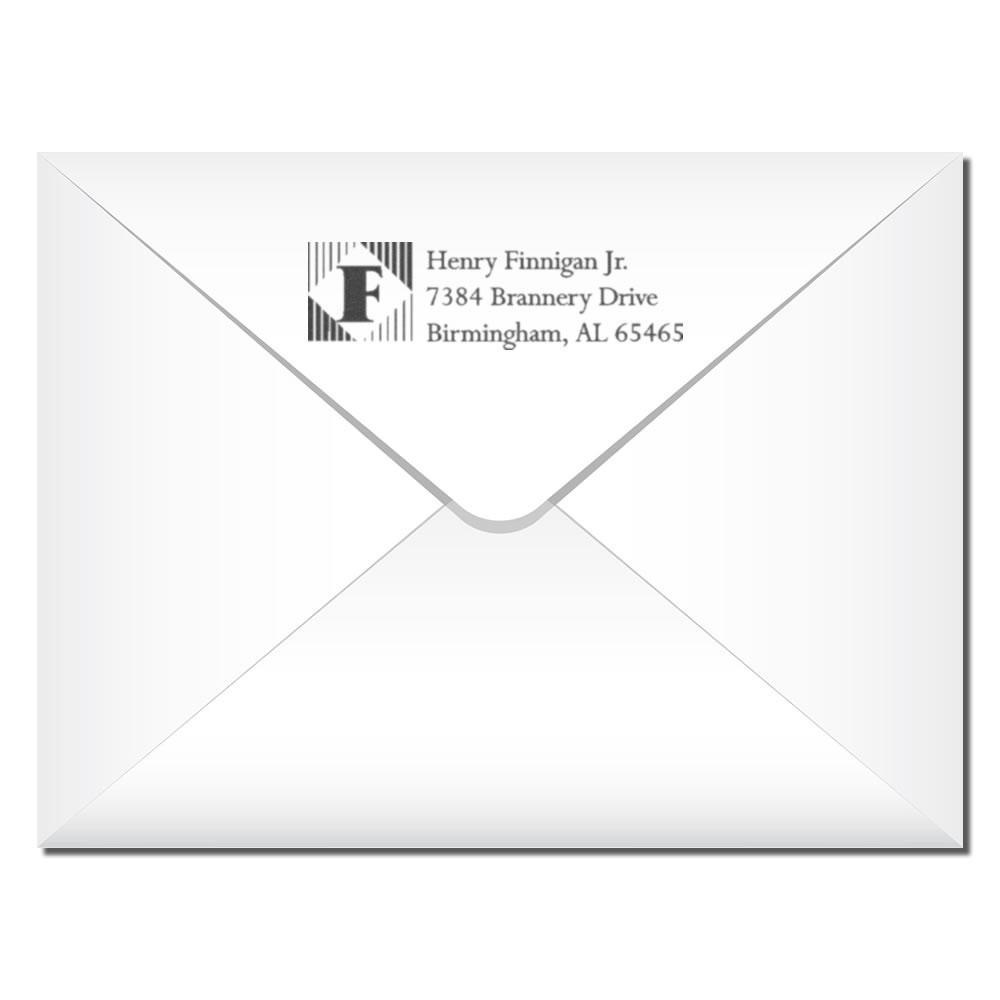 Personalized address rubber stamp on envelope with monogram logo for professional mailing and return address use.