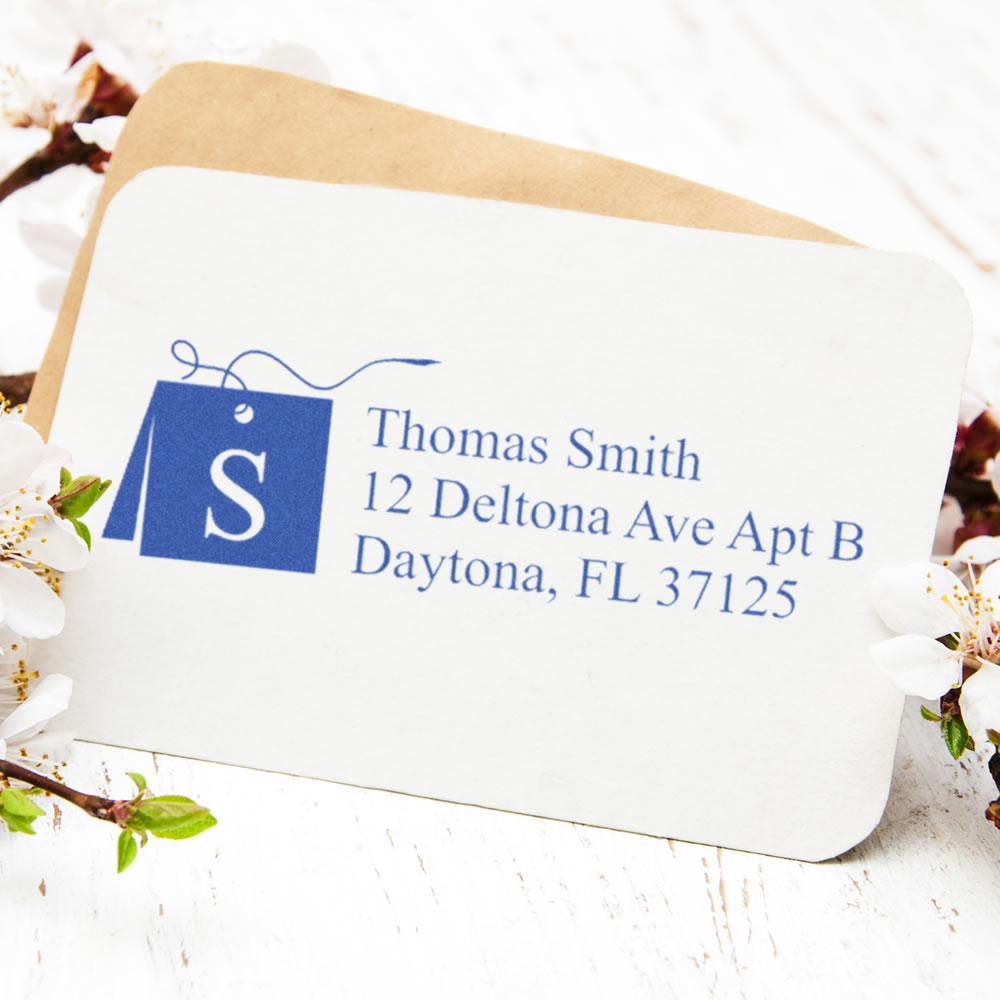 Custom return address rubber stamp with monogram S, Thomas Smith, and Daytona, FL address.
