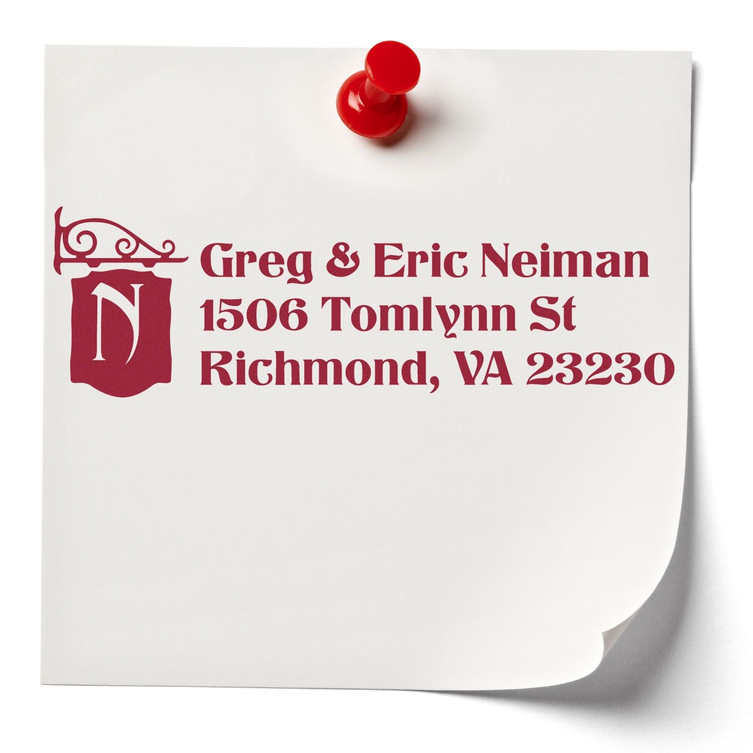 Custom return address rubber stamp with monogram logo, featuring Greg & Eric Neiman address on paper mockup.
