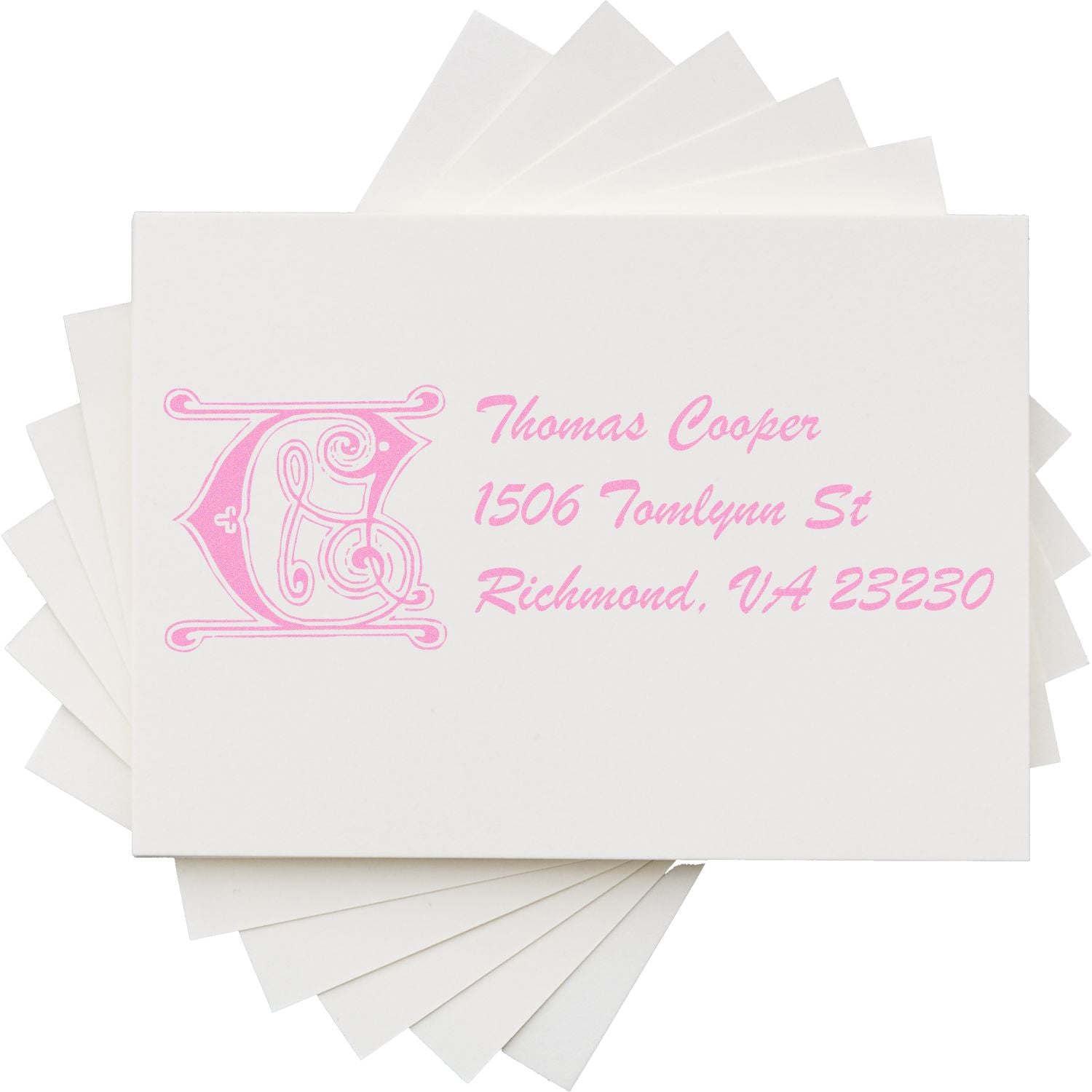 Custom return address rubber stamp with ornate monogram and pink ink for Thomas Cooper, Richmond, VA 23230.