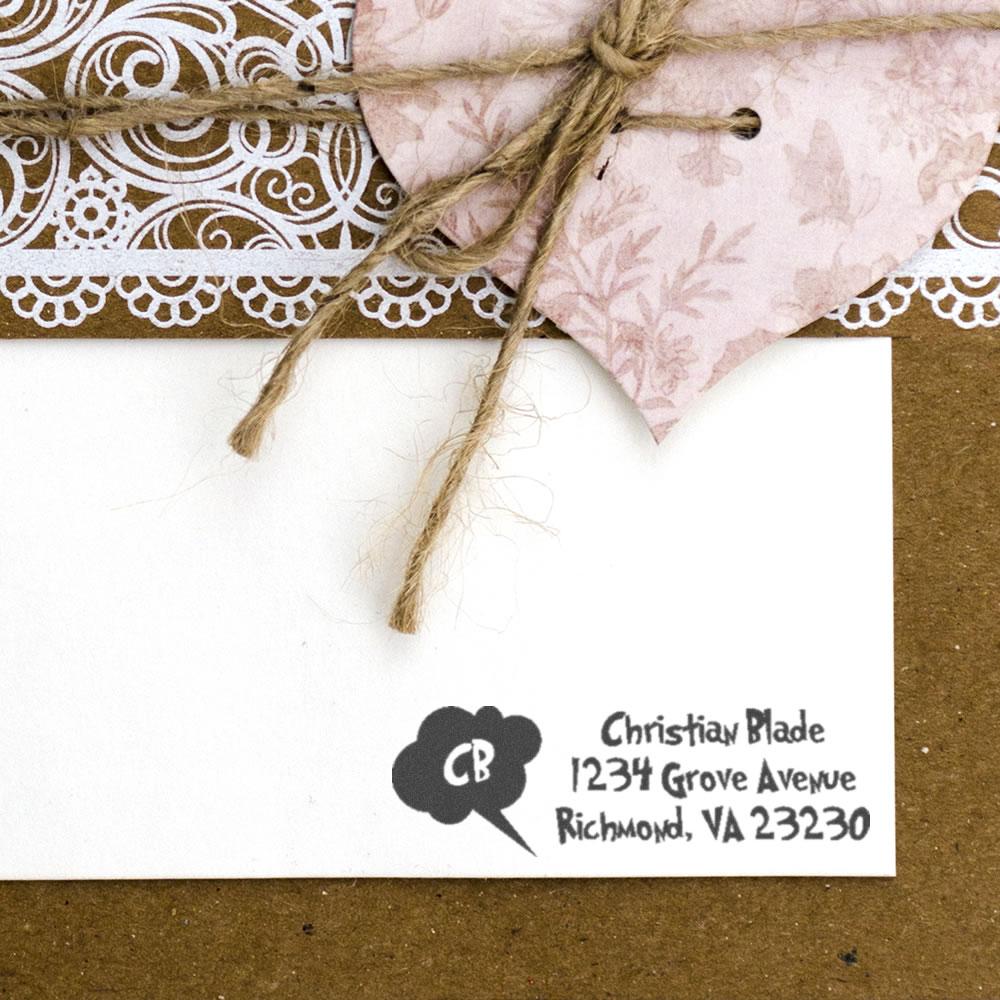 Custom return address rubber stamp on a handmade gift tag with twine and lace, ideal for wedding and craft stationery.