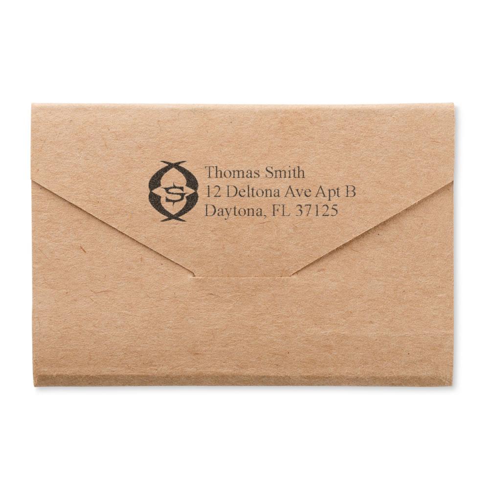 Custom return address rubber stamp on kraft envelope with name and Daytona, FL address for mailing and branding.