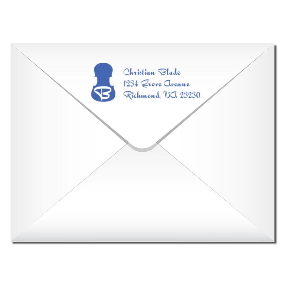 Custom return address rubber stamp on envelope for personalized mailing and business correspondence.