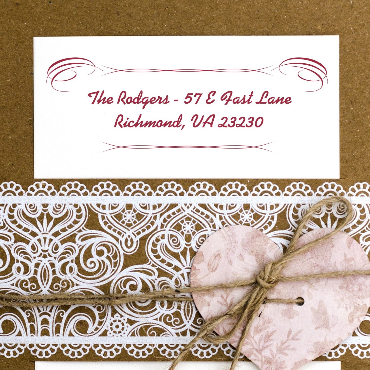 Custom return address rubber stamp with elegant flourish design for wedding invitations and stationery.