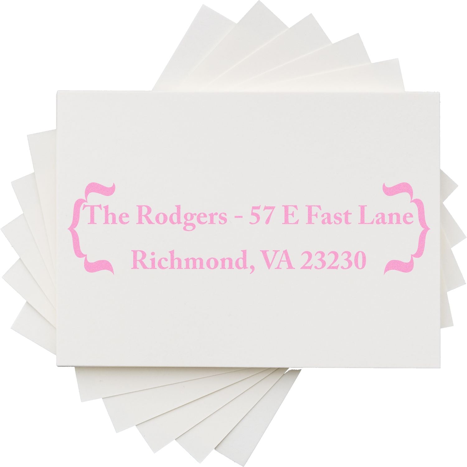 Custom pink address rubber stamp on white card, featuring The Rodgers, 57 E Fast Lane, Richmond, VA 23230.