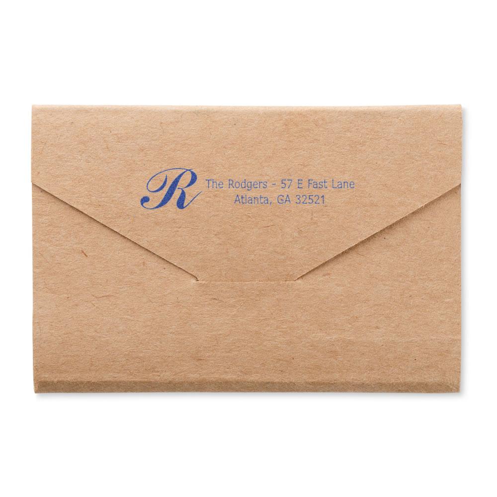 Custom address rubber stamp on kraft envelope with monogram, ideal for personalized business or wedding mailing.