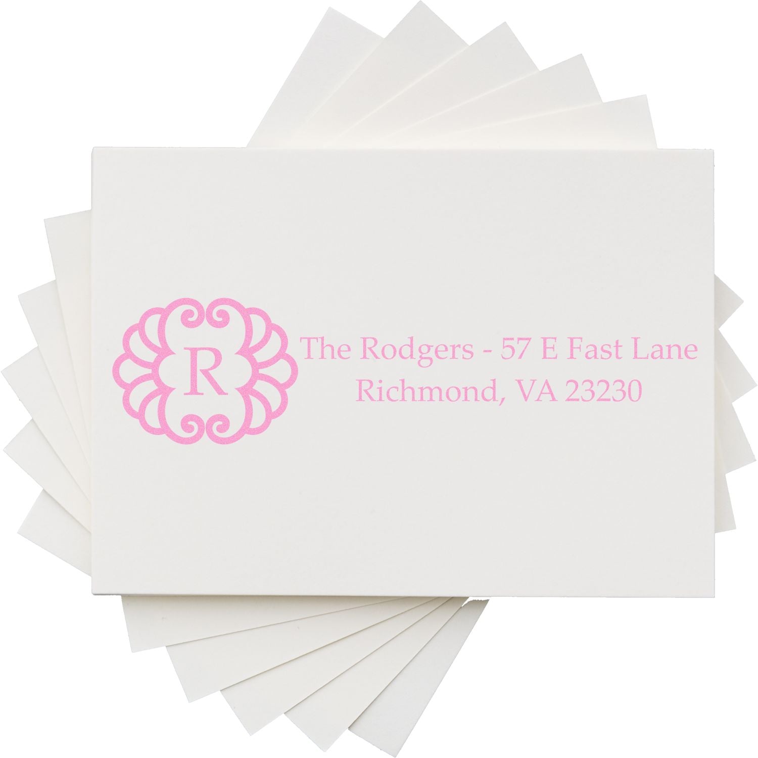 Custom monogram return address rubber stamp on stationery, ideal for personalized wedding invitations and envelopes.