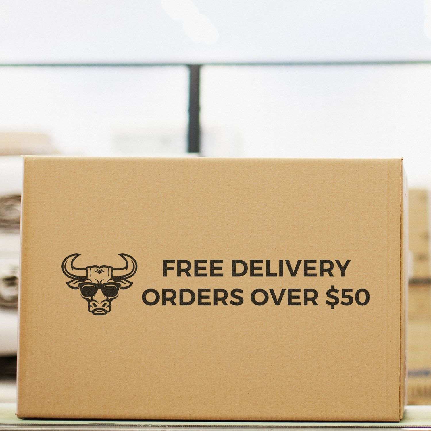 Cardboard delivery box advertisement for eCommerce: free delivery on orders over $50, fast shipping promotion