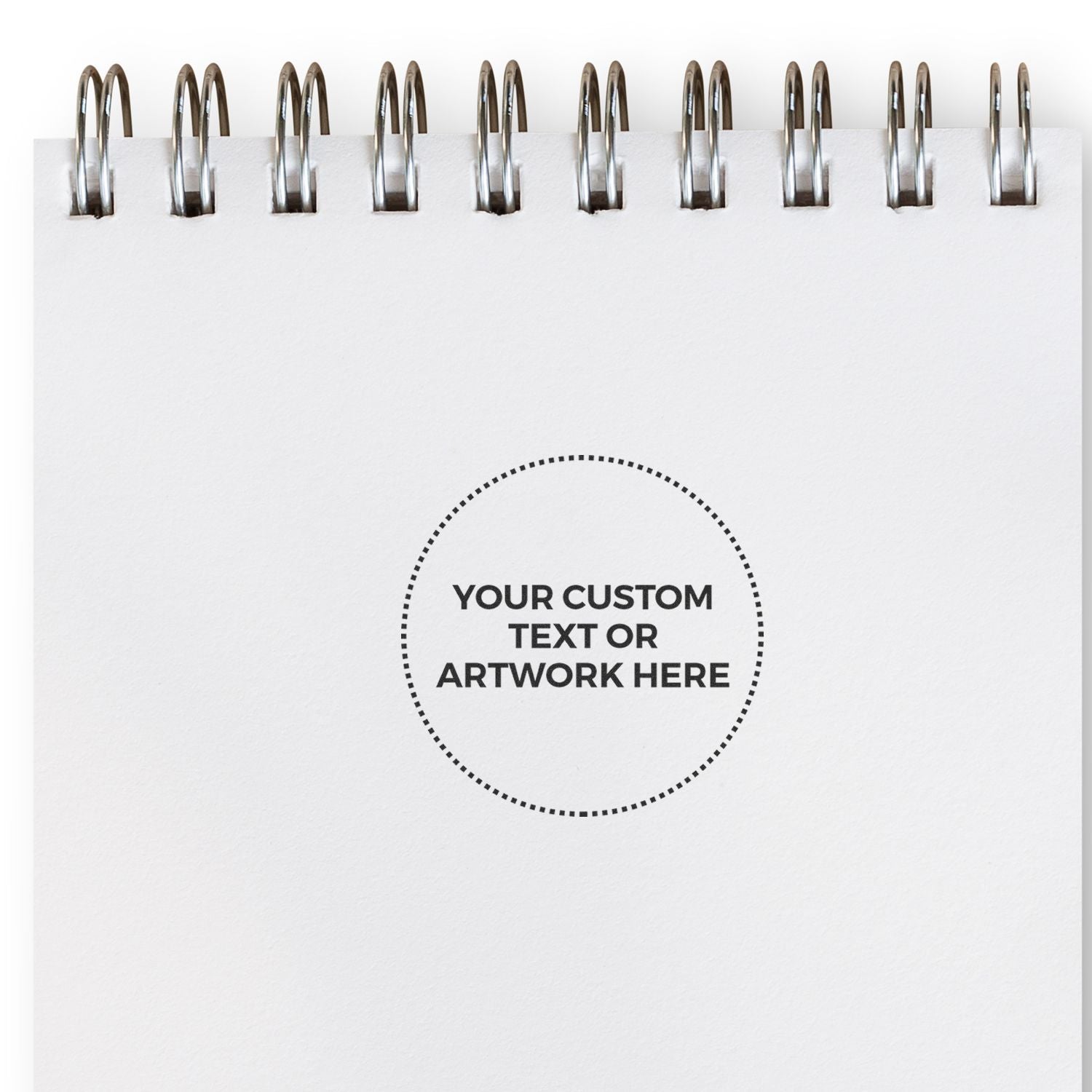 Blank spiral notebook mockup with white paper page and custom text or artwork placeholder circle.