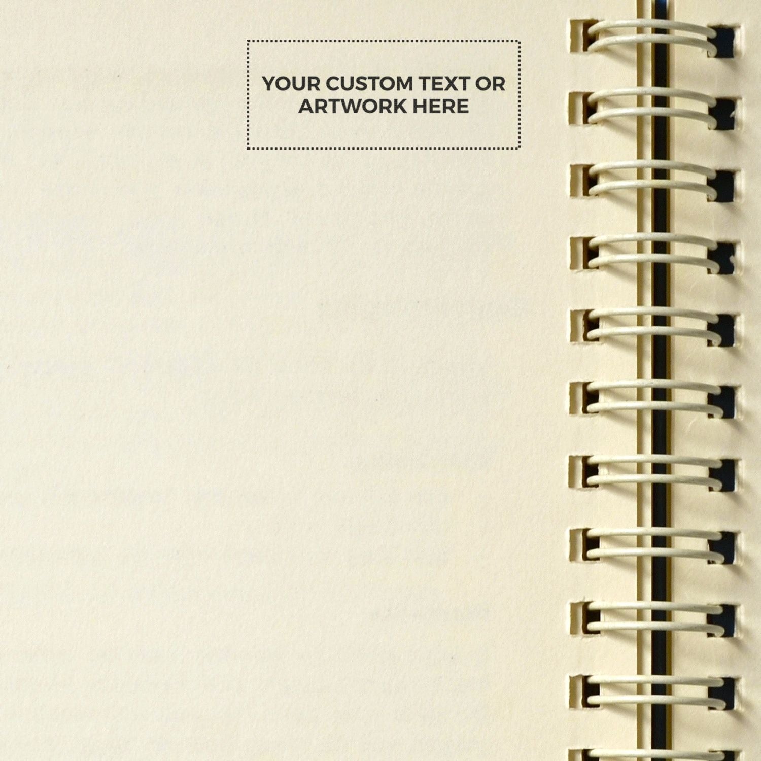 Blank spiral notebook page mockup with custom text or artwork area on cream paper.