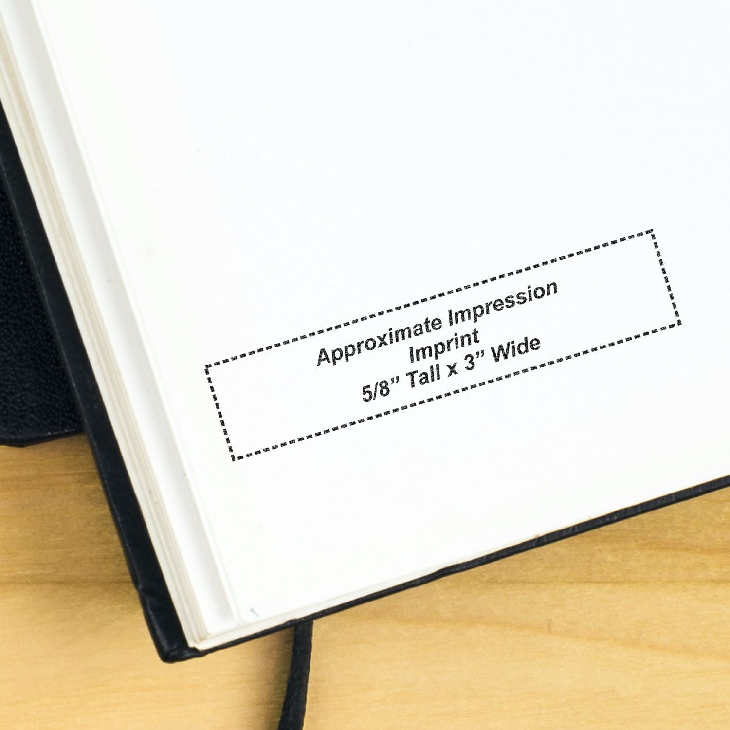 Close-up of open notebook page showing approximate imprint area, 5/8 inch tall by 3 inches wide, for custom logo printing.