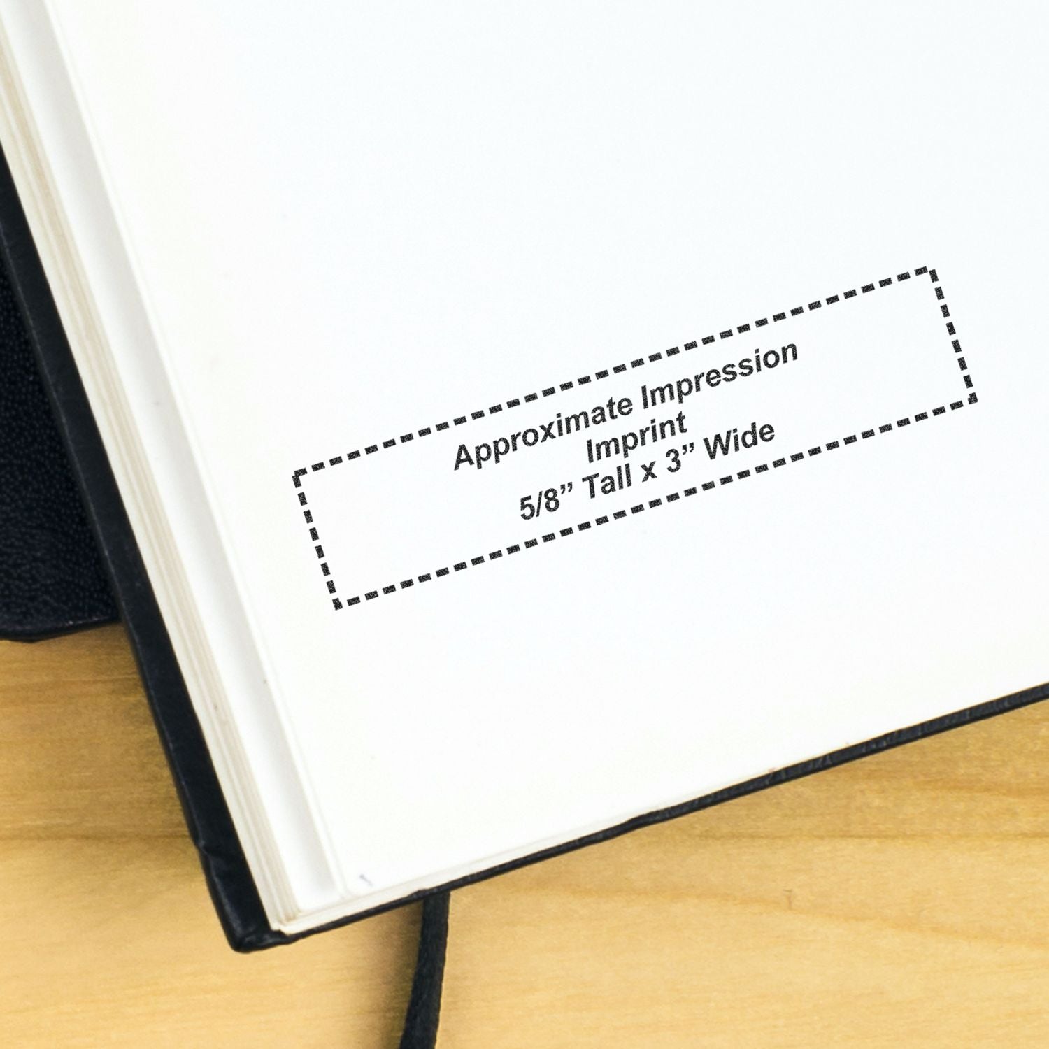 Close-up of open book page with dotted imprint area, showing approximate impression imprint size 5/8 inch tall by 3 inches wide.
