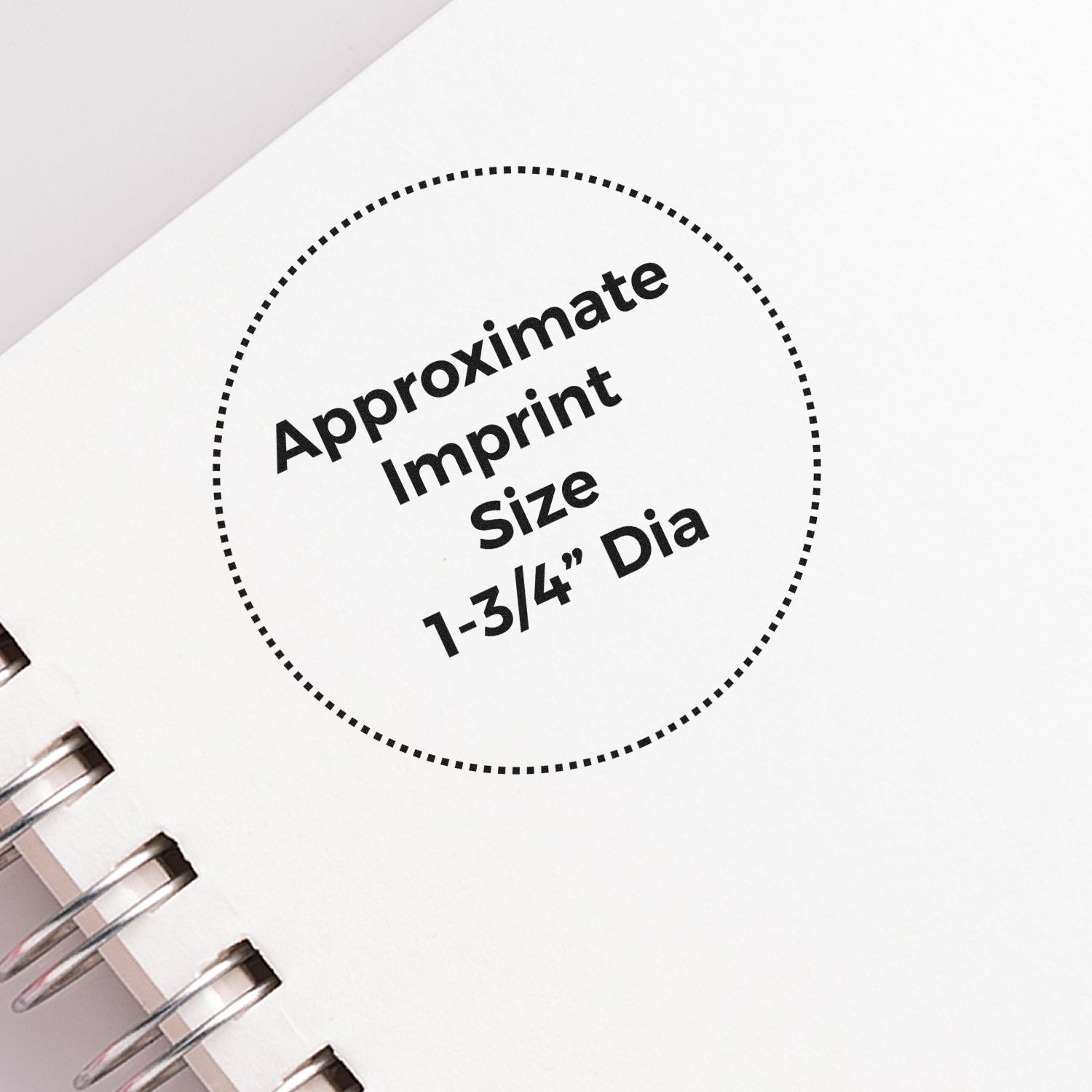 Close-up of spiral notebook cover showing approximate imprint size circle, 1-3/4 inch diameter.