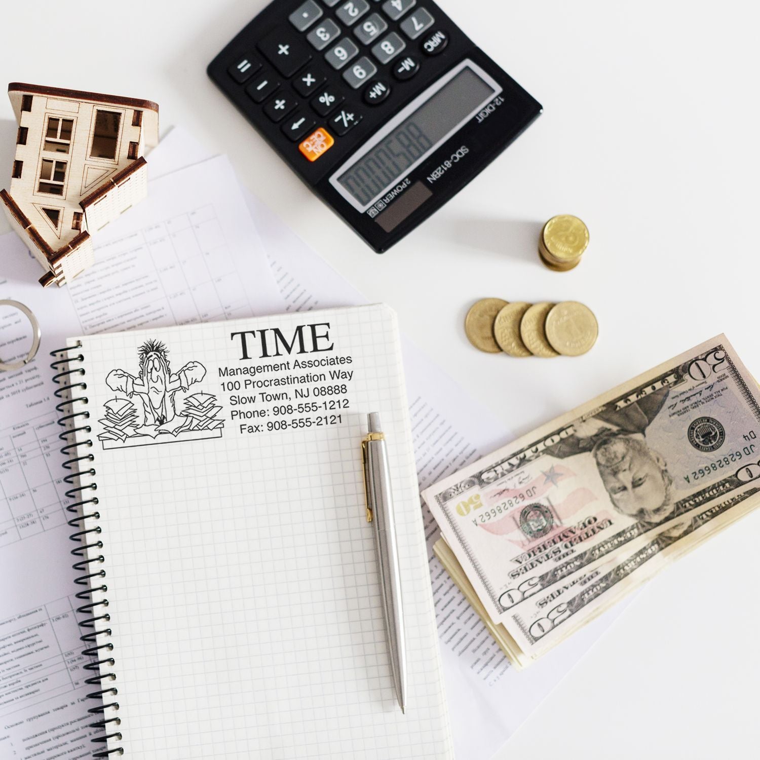 Calculator and coins with notebook labeled TIME and money, illustrating personal budgeting and financial planning for savings.