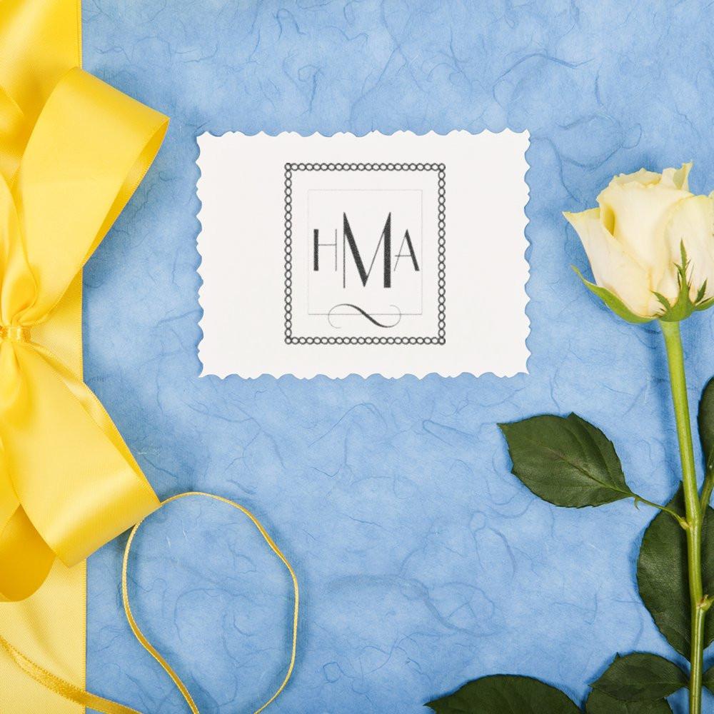 HMA monogram rubber stamp design on scalloped paper, styled for wedding invitations and personalized stationery.