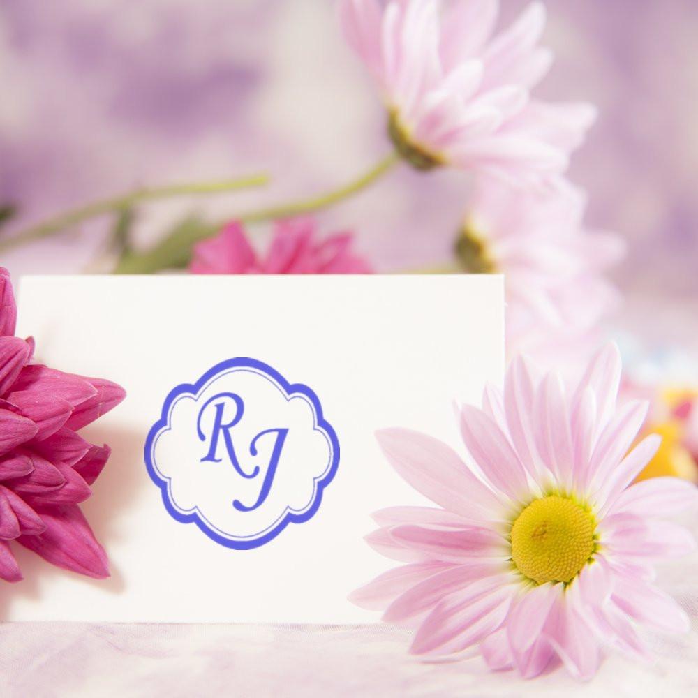 Custom monogram rubber stamp with floral frame and initials RJ, ideal for wedding stationery, cards, and invitations.