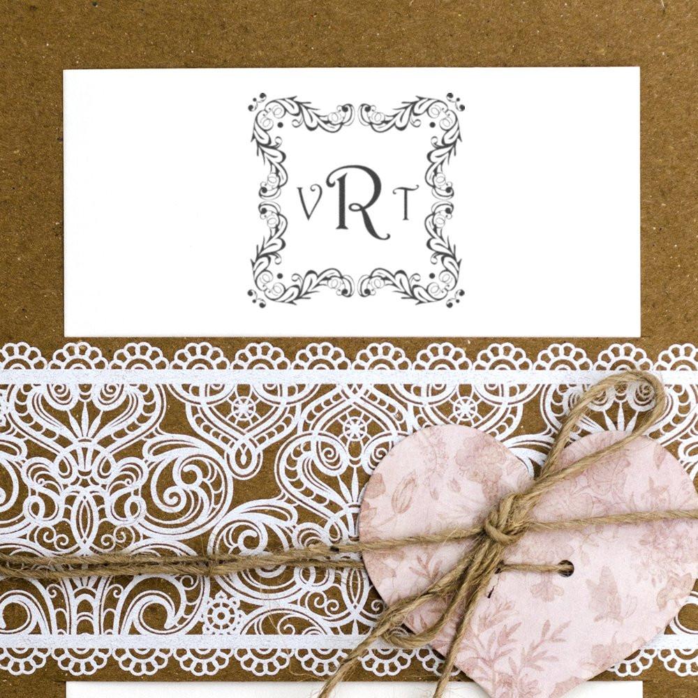 Custom monogram rubber stamp with ornate floral frame for wedding invitations, gift tags, and handmade cards.