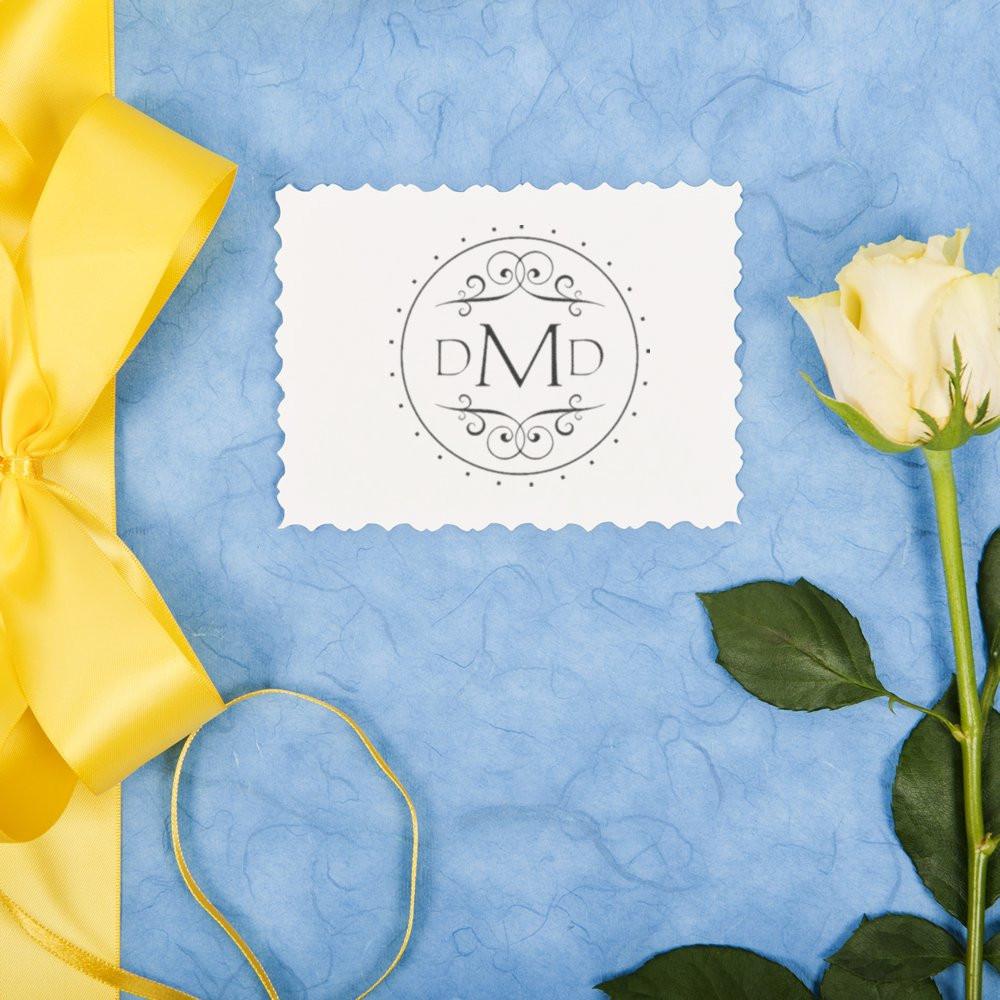 Custom monogram rubber stamp with decorative DMD design for wedding invitations, stationery, and personalized gifts.