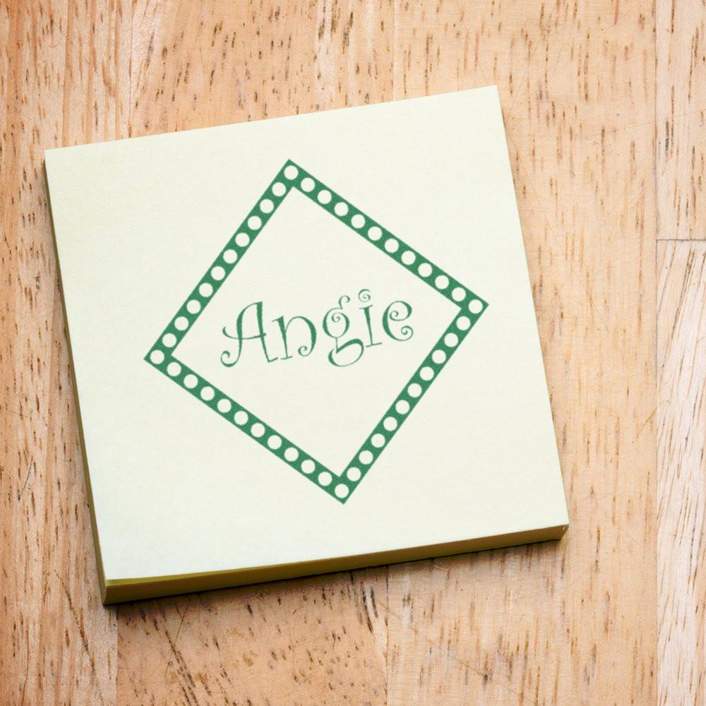Custom Angel rubber stamp impression on a square card with green polka dot diamond frame, ideal for personalized crafting and stationery.