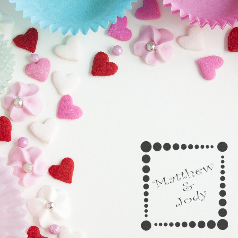 Custom wedding rubber stamp with Matthew & Jody text, framed by pink and red hearts for romantic stationery and favor packaging.