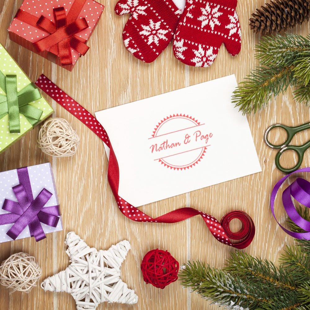 Personalized rubber stamp with Nathan & Page design for holiday gift wrapping and festive packaging.