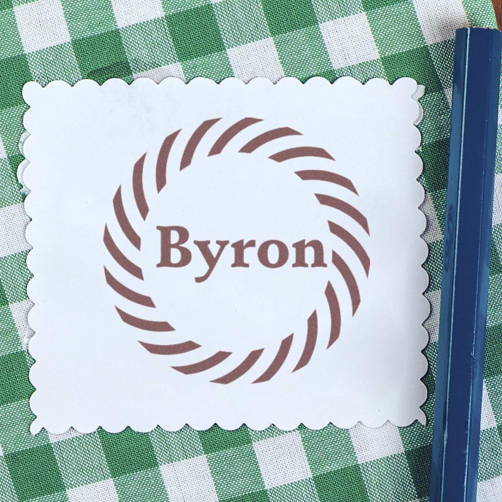 Personalized rubber stamp design with the name Byron in a decorative circular monogram on scalloped paper.