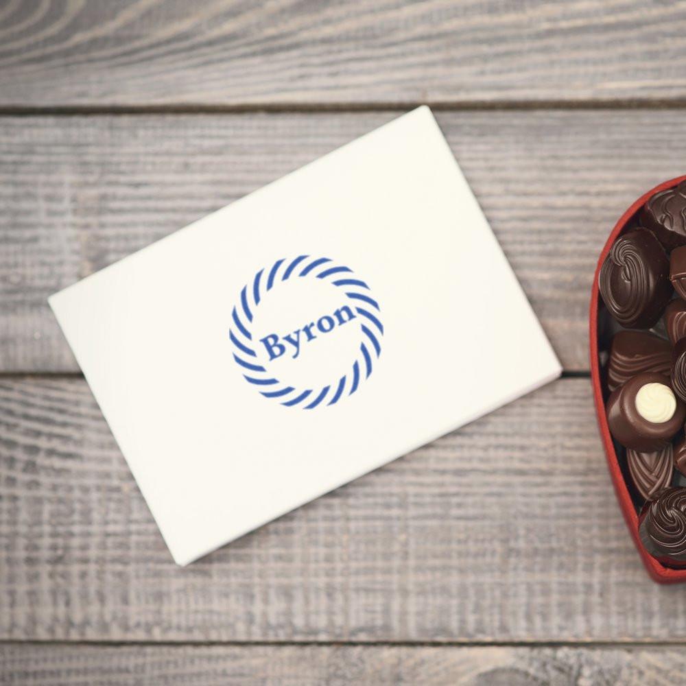 Custom logo rubber stamp on envelope featuring Byron swirl design, ideal for branded stationery and gift packaging.