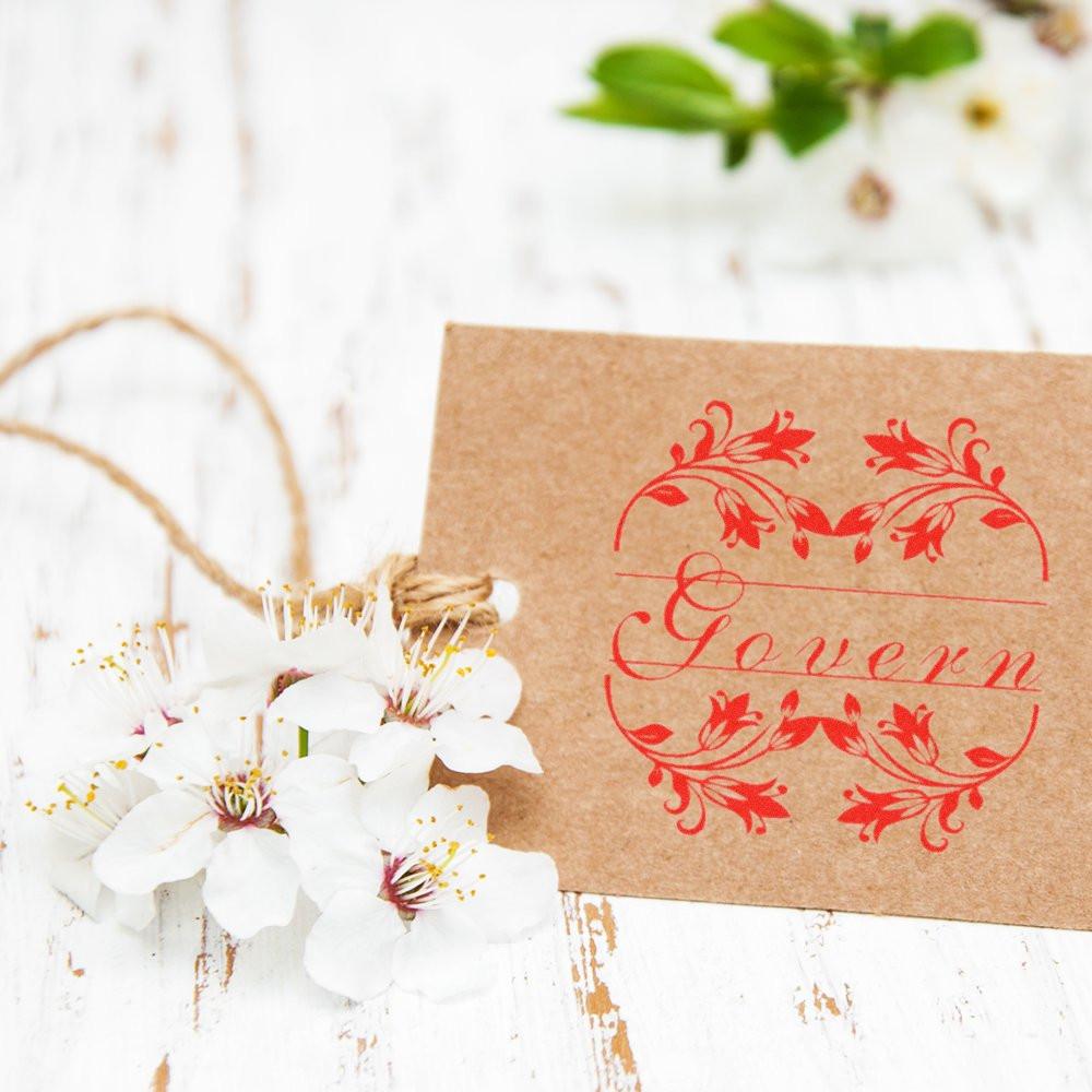 Handmade floral greeting card on kraft paper with red script design and white blossoms, perfect for wedding or invitation