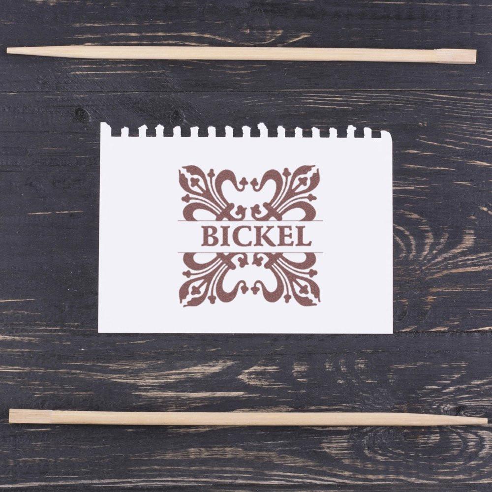 Custom rubber stamp with ornate BICKEL logo, ideal for branding packaging, stationery, and business identity.