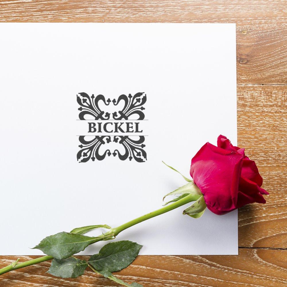 Ornate BICKEL personalized rubber stamp on white paper, ideal for custom branding, invitations, and stationery.