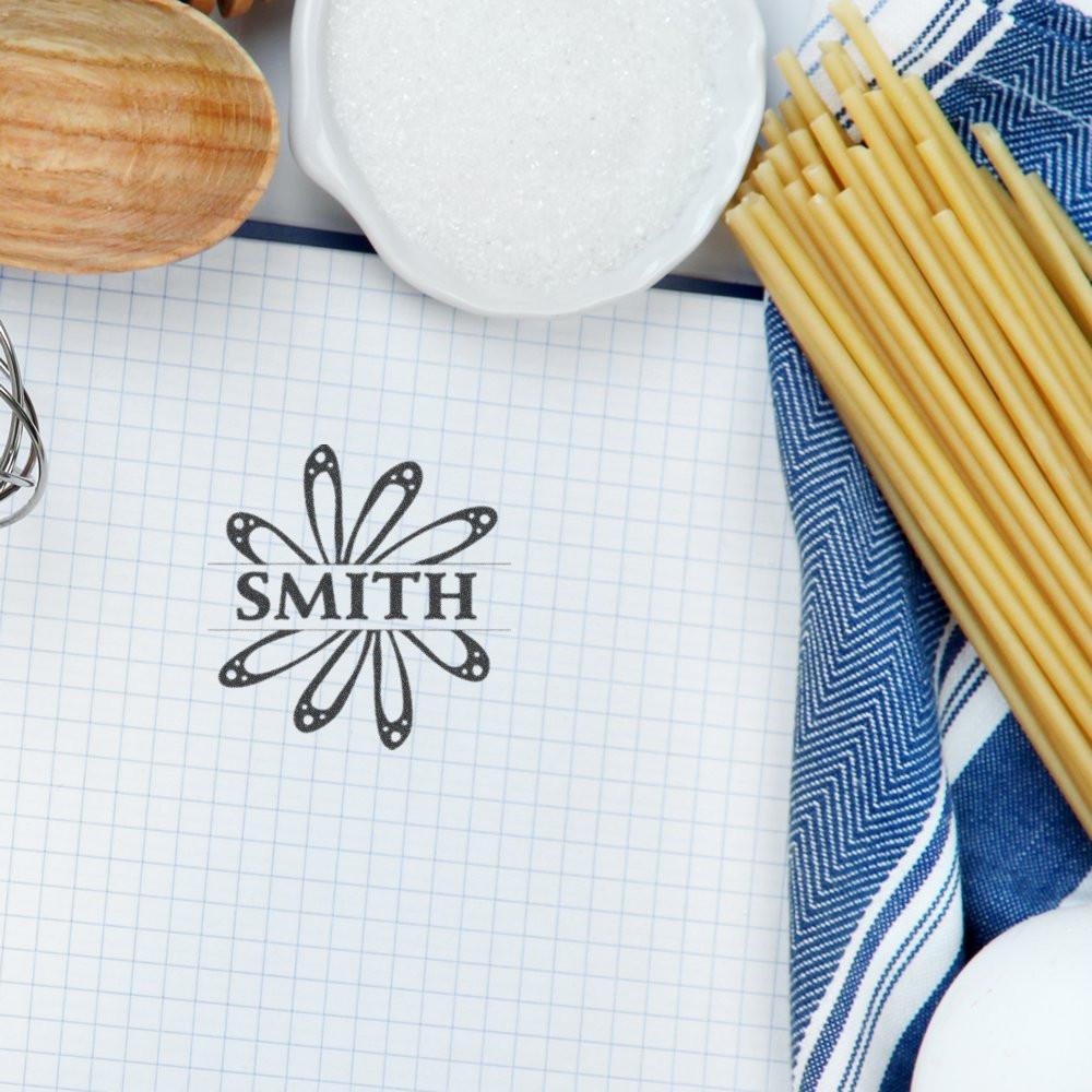 Custom rubber stamp with Smith family name and floral monogram for personalized stationery, weddings, or small business branding.