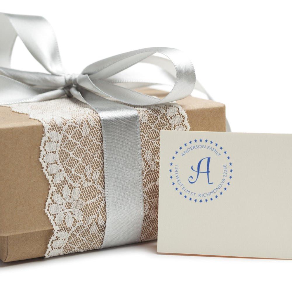 Anderson Family personalized gift box with silver satin ribbon and lace trim, holding a branded greeting card on white background