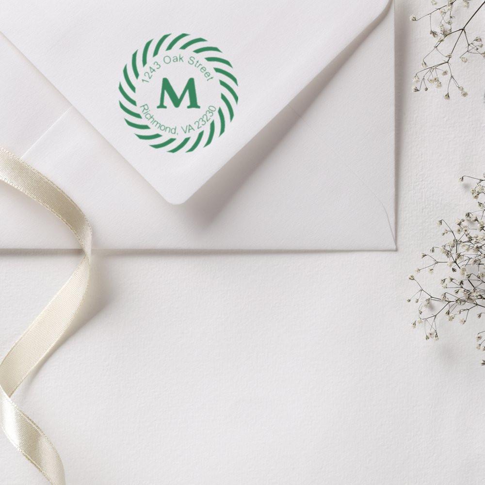 Branded Oak Street Richmond VA envelope with circular logo for mail correspondence, featuring a prominent letter M.