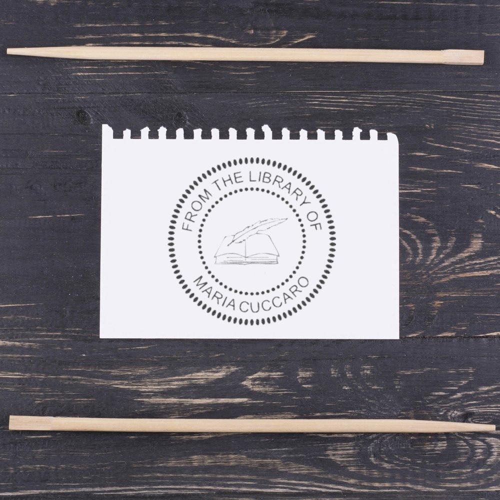 Custom round library rubber stamp reading From the Library of Maria Cuccaro for books, lending, and personal collections.