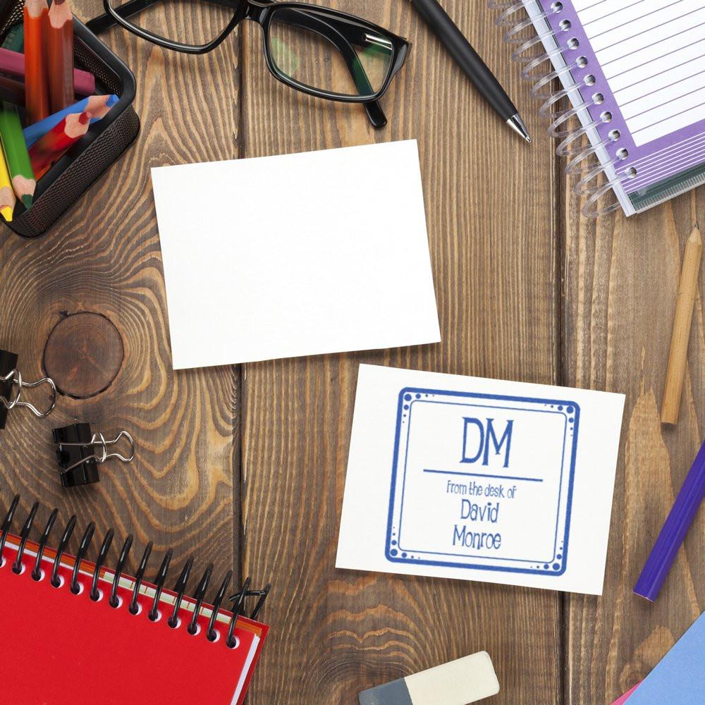 Custom rubber stamp impression on stationery, personalized From the Desk of David Monroe desk stamp for office use.