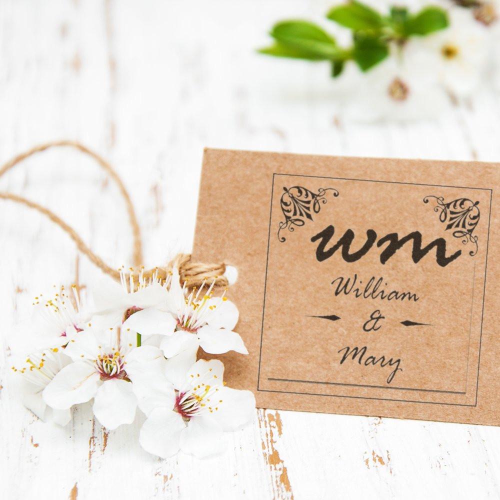 Custom wedding monogram rubber stamp with William & Mary initials on kraft card, ideal for invitations, favors and packaging.
