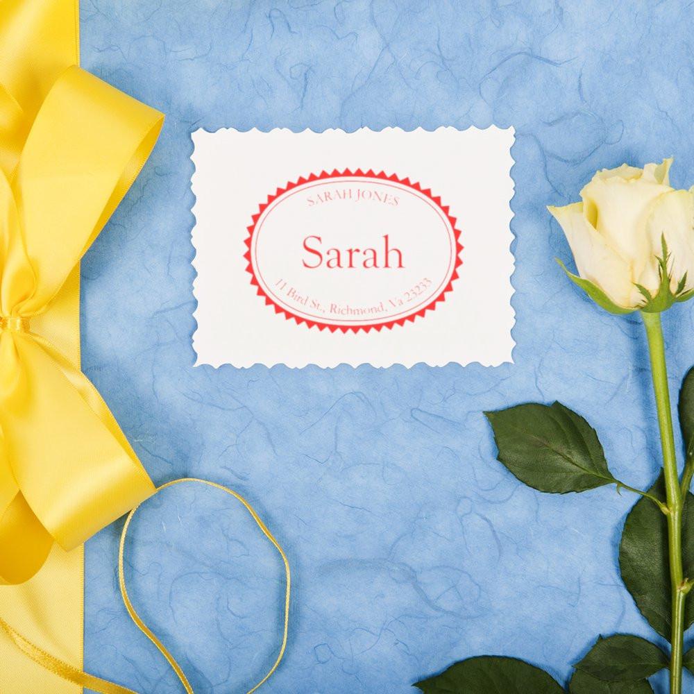 Personalized rubber address stamp for wedding stationery, featuring Sarah name and return address on a decorative card.