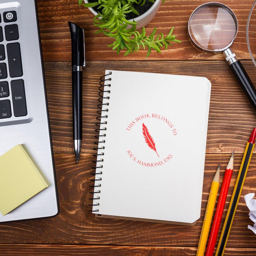 Custom rubber book stamp with This Book Belongs To design, personalized for lawyers and book ownership labeling.