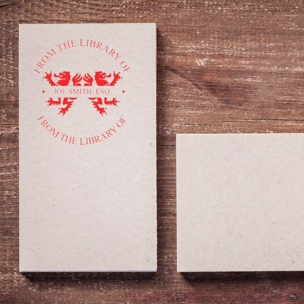 Custom library rubber stamp with personalized bookplate imprint reading From the Library of Joe Smith, Esq.