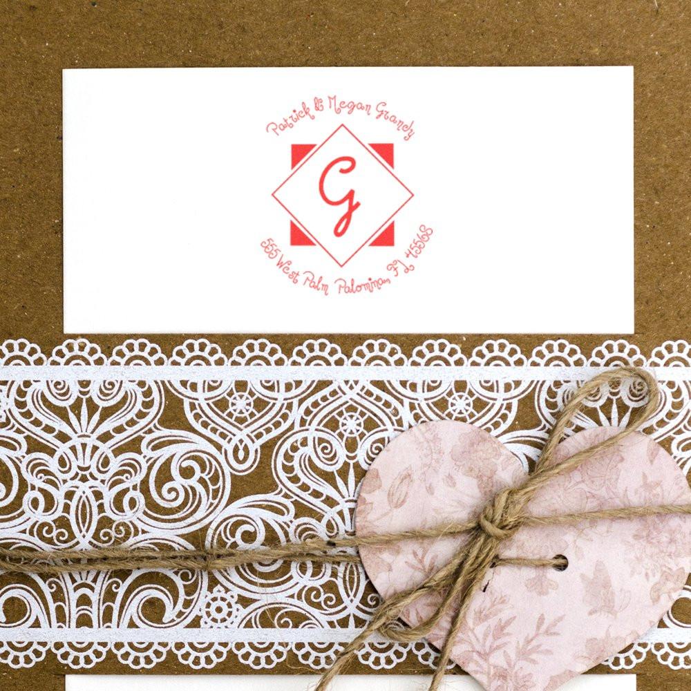 Custom monogram rubber stamp for wedding invitations, featuring a personalized initial logo and return address design.