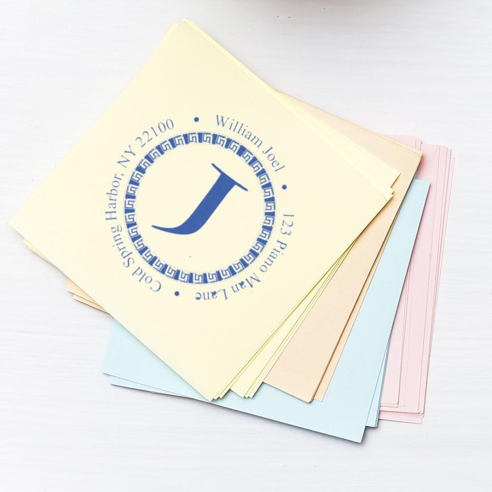 Personalized return address rubber stamp with monogram J on pastel stationery and note cards