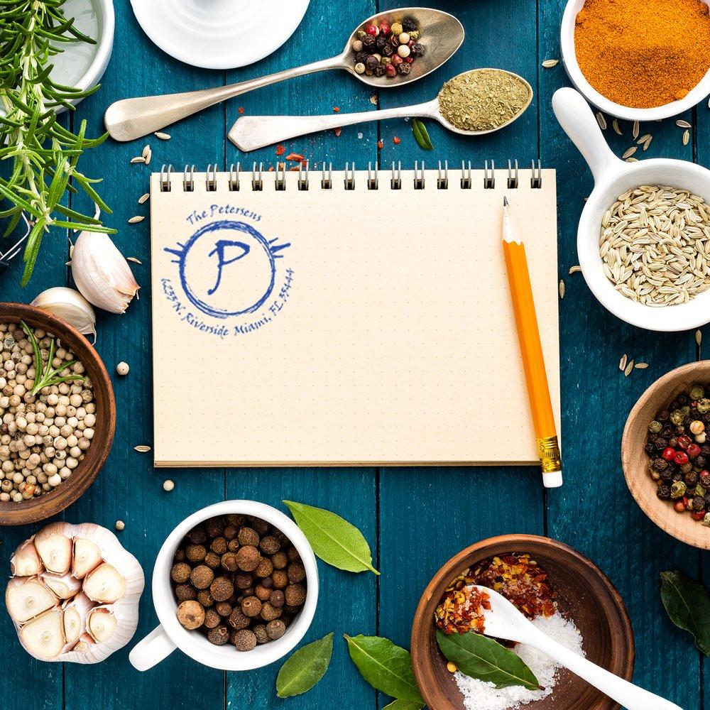 Herbs and spices around an open recipe notebook with penhome cooking meal planning, seasoning inspiration, and spice blend ideas.