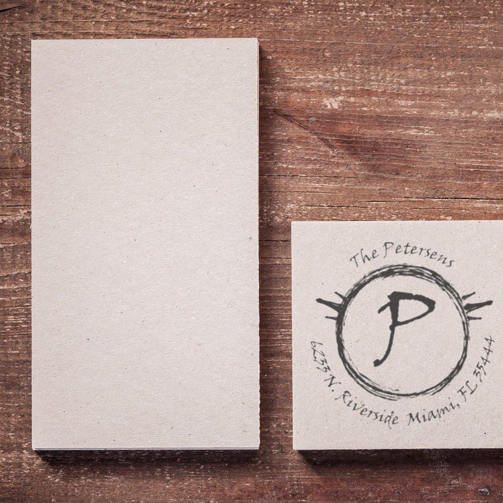Rustic wood backdrop with blank stationery card and The Petersens logo monogram P note card, branding mockup.
