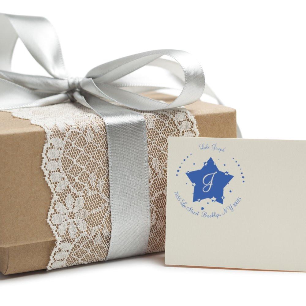 Handmade wedding gift box wrapped in kraft paper with silver ribbon and lace trim, tied bow, with matching greeting card.