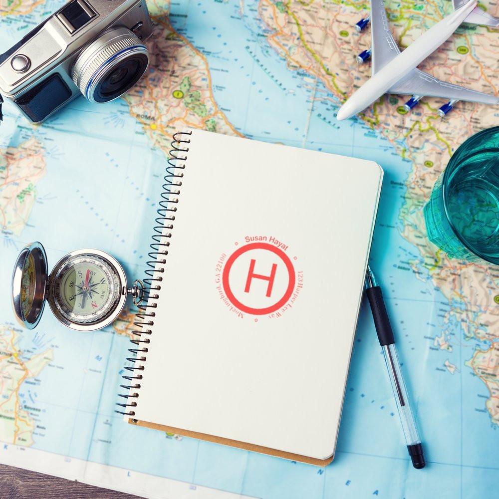Travel planning flat lay with compass, airplane and camera over world map and notebookideal for trip preparation and itinerary ideas.