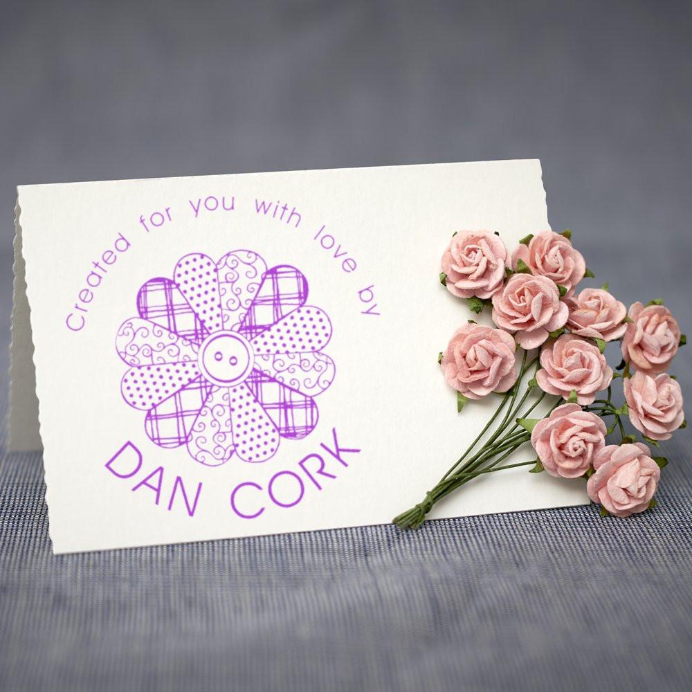 Custom rubber stamp impression with flower graphic and pink roses, reading Created for you with love by Dan Cork.