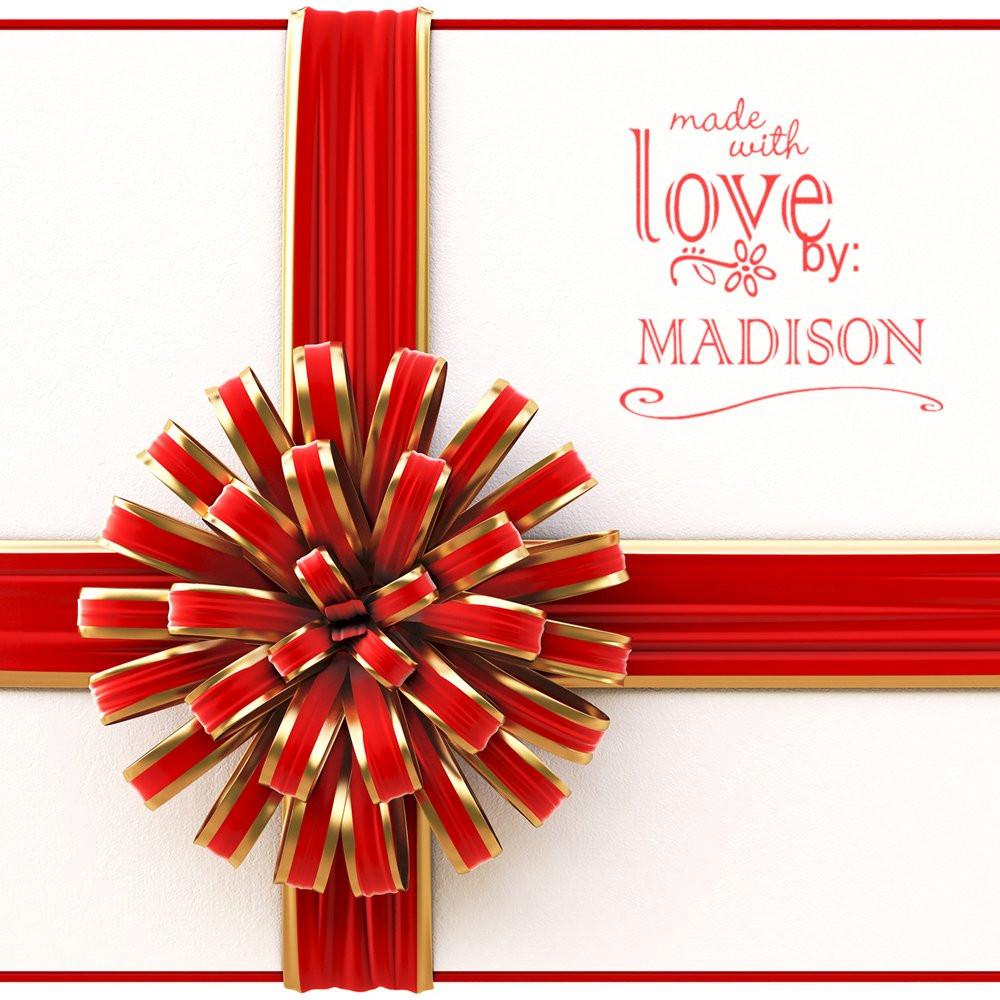 Custom rubber stamp reading Made with Love by Madison for personalized gift wrapping and handmade packaging.