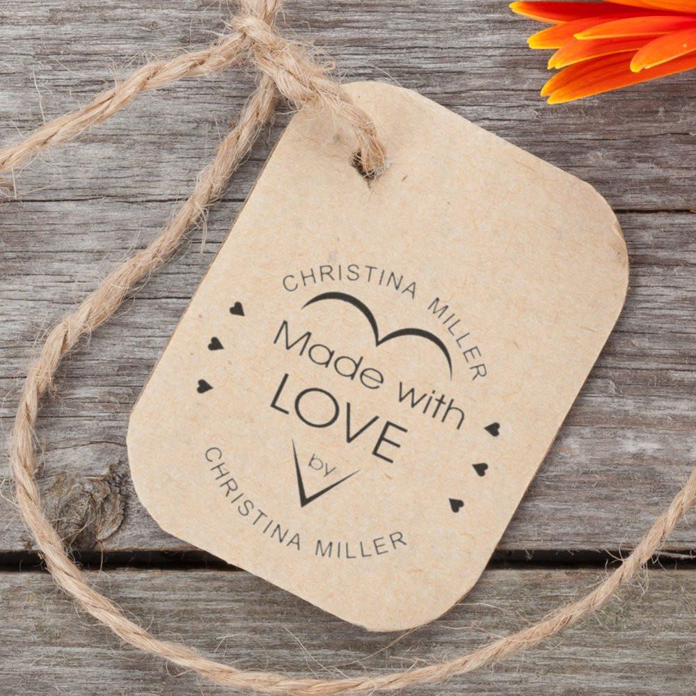 Custom rubber stamp on kraft gift tag with Made with Love design, ideal for handmade product packaging.